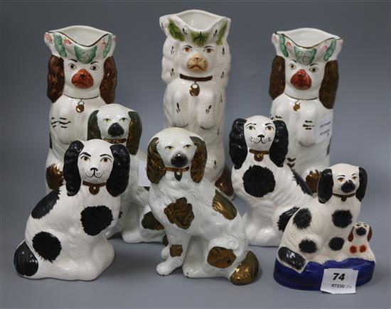 Eight various modern Staffordshire pottery dogs, including three dog jugs tallest 26cm